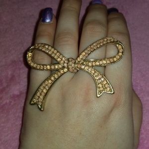 Gold with light pink gems bow 2 finger ring
